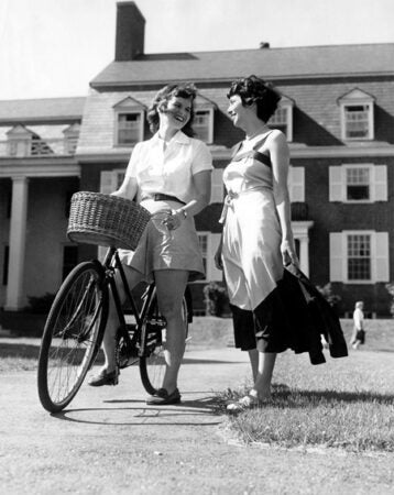 American | Student Activities; students standing with bicycle | Colby College Special Collections