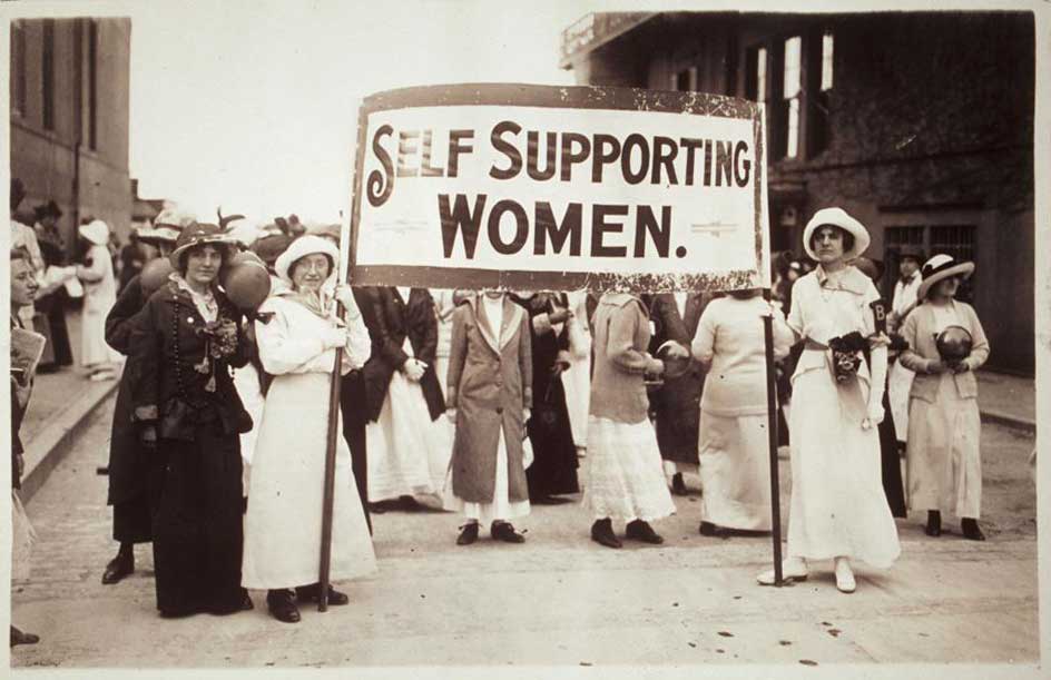 Unknown; Young women holding a sign which reads, 'Self Supporting Women.' Several other women grouped near the banner are holding balls; 1914. This image has been made available by the Schlesinger Library, Radcliffe Institute, Harvard University
