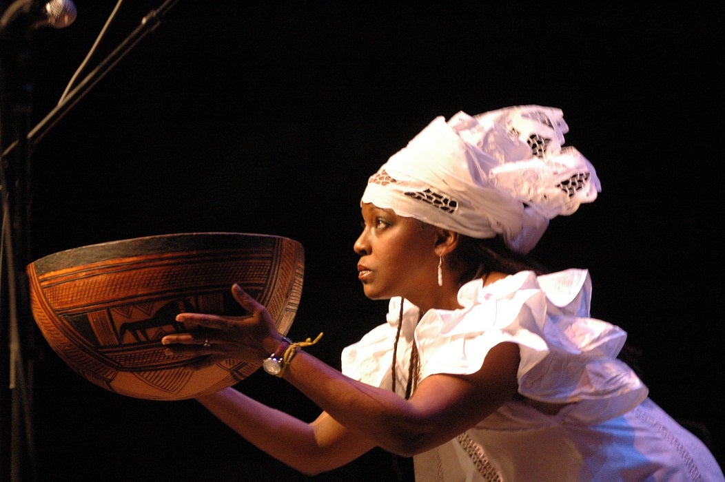 Bob Gore. Woman with gourd, Kwanzaa celebration. 2006. Image and data provided by Bob Gore.