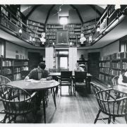 Photograph of students and a woman reading in the Joseph Krauskopf Memorial Library