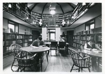 Photograph of students and a woman reading in the Joseph Krauskopf Memorial Library