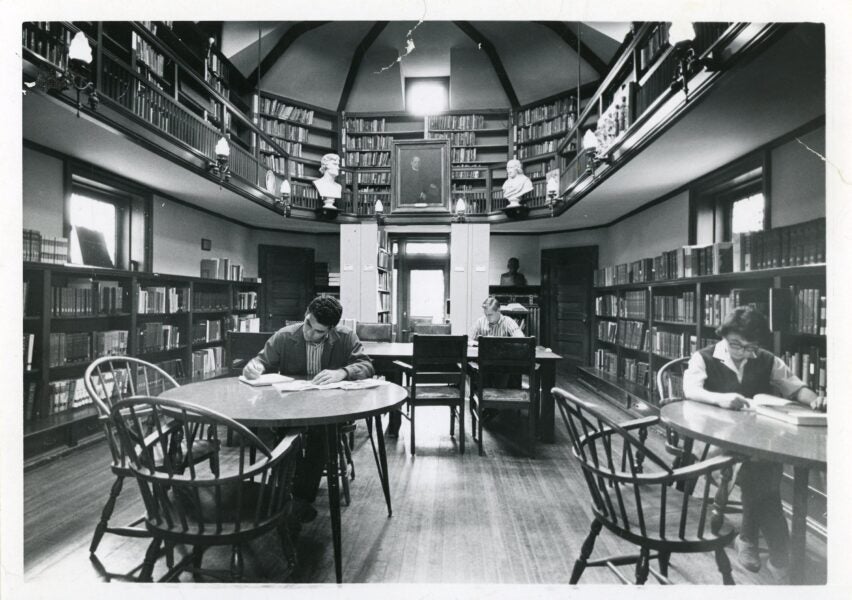 Photograph of students and a woman reading in the Joseph Krauskopf Memorial Library