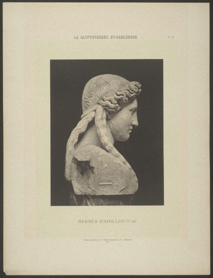 Black-and-white photograph of a marble bust labeled Hermes d’Apollon, showing a side profile of a classical sculpture.