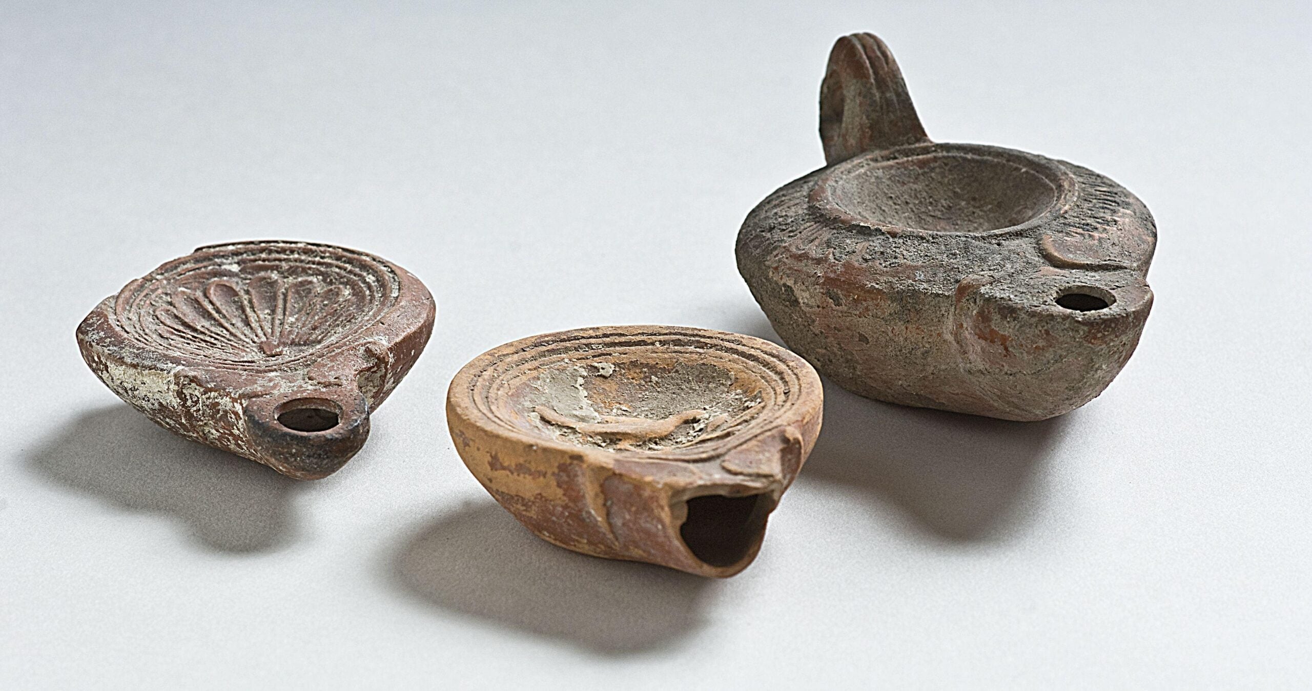 Roman. Group of Three Terracotta Lamps. 1st century BCE. Smith College, Van Buren Antiquities Collection.