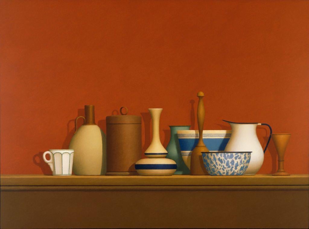 A collection of minimalist vessels, bowls, and pitchers in muted tones arranged against a deep orange backdrop.