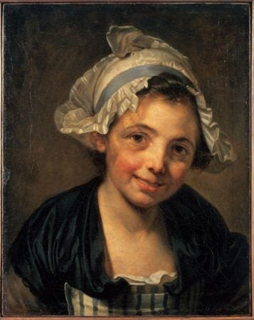 A portrait of a young girl with rosy cheeks, a warm smile, and an expressive gaze. She wears a delicate white bonnet with ruffled edges tied with a blue ribbon, framing her face. Her dark garment contrasts with the soft tones of her skin and bonnet. The background is muted, emphasizing her lively expression and the subtle textures of her clothing and headwear. The painting captures a sense of innocence and charm characteristic of 18th-century portraiture.