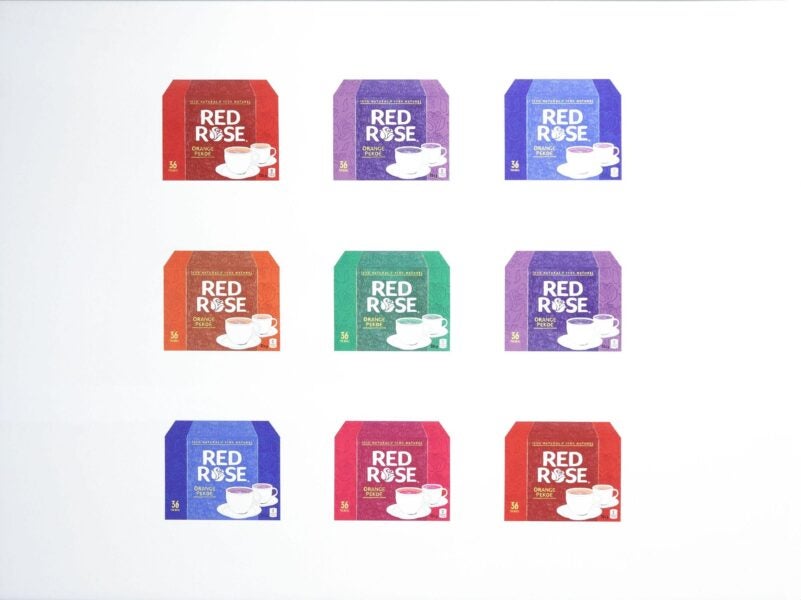 Digital artwork featuring a 3x3 grid of colorful Red Rose tea boxes in different hues. Each box has the same design—white teacup and saucer with “Red Rose Orange Pekoe” written across the front—highlighting branding and repetition in consumer goods.
