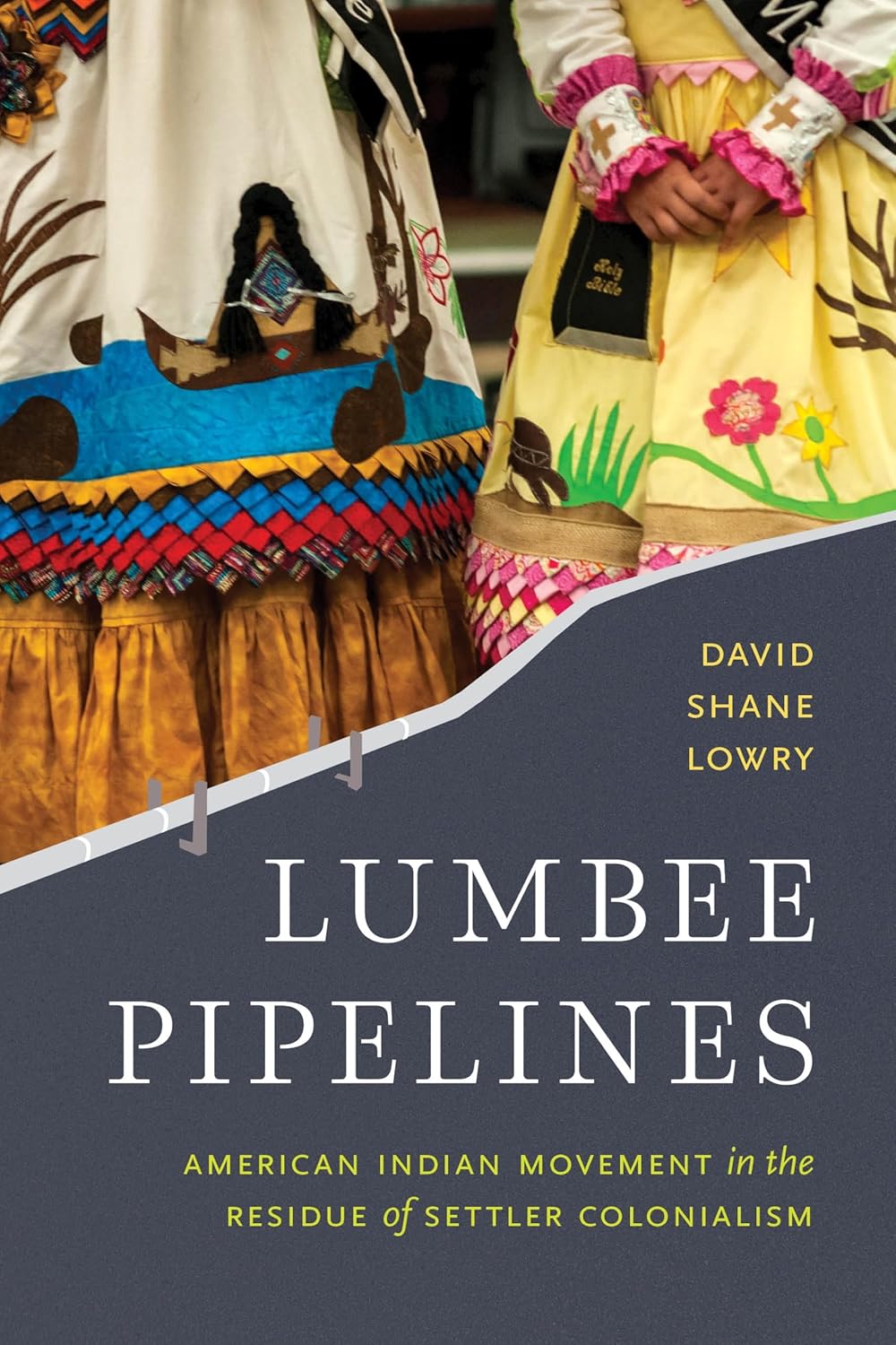 Cover of Lumbee Pipelines: close-up of two people in brightly embroidered regalia; diagonal dark-gray panel carries the white title and yellow author name.