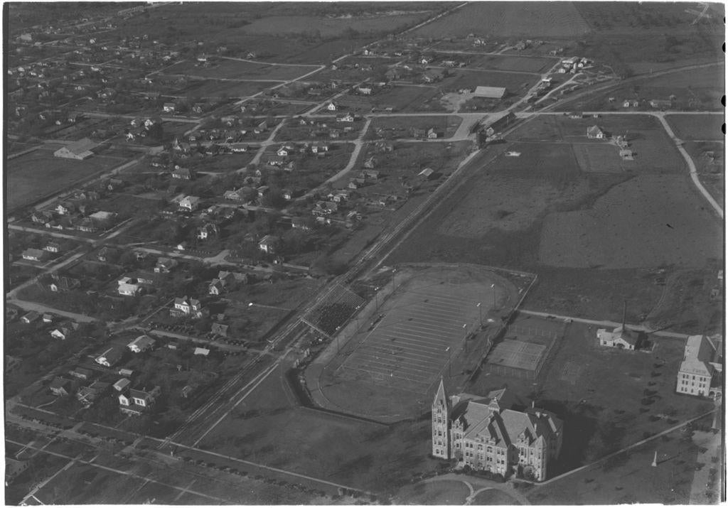 Aerial photograph looking northwest from University Avenue over Southwestern University Main Building and Athletic Field.