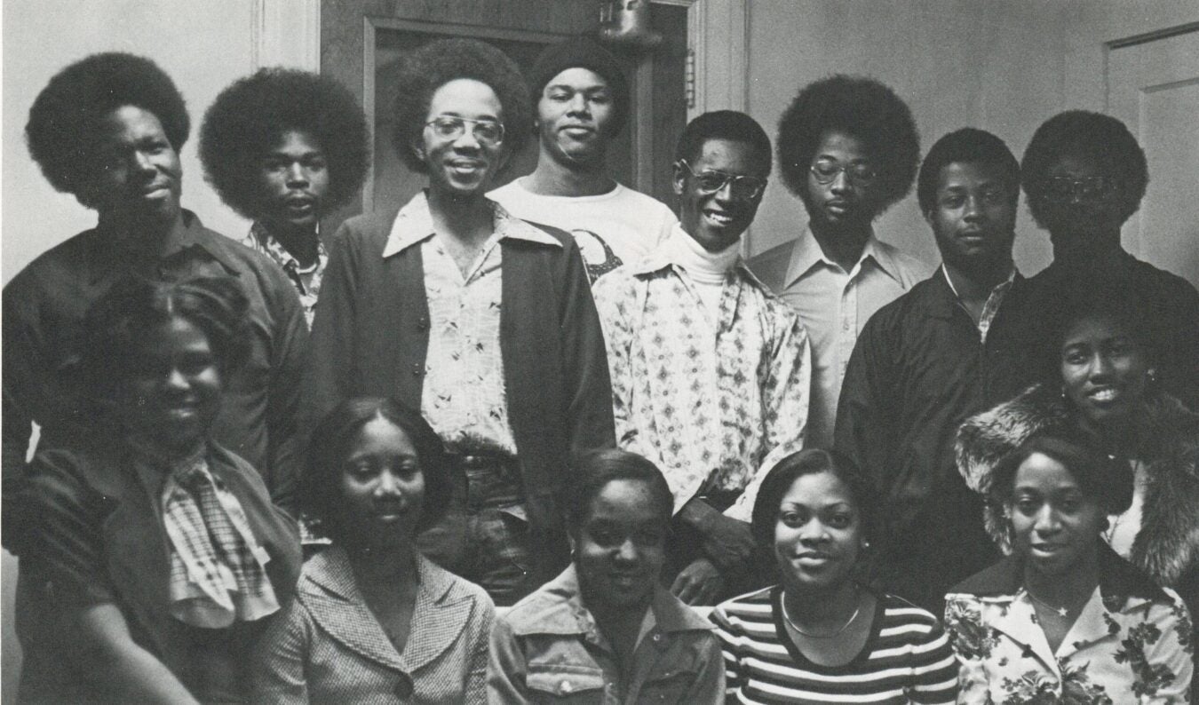 Group portrait of Black Student Union members at Rollins College, 1975–1976, posing together indoors.