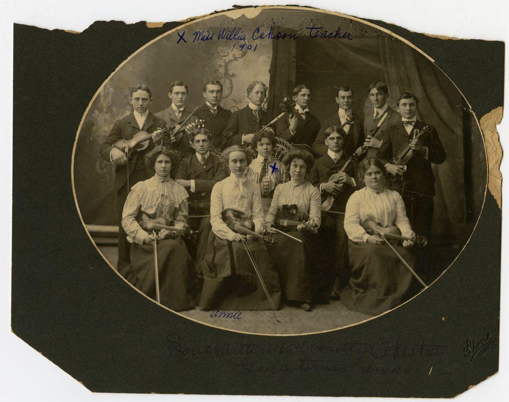 Black-and-white portrait of the 1901 Southwestern University Orchestra with musicians holding violins and other string instruments, including teacher Miss Willie Calhoun.