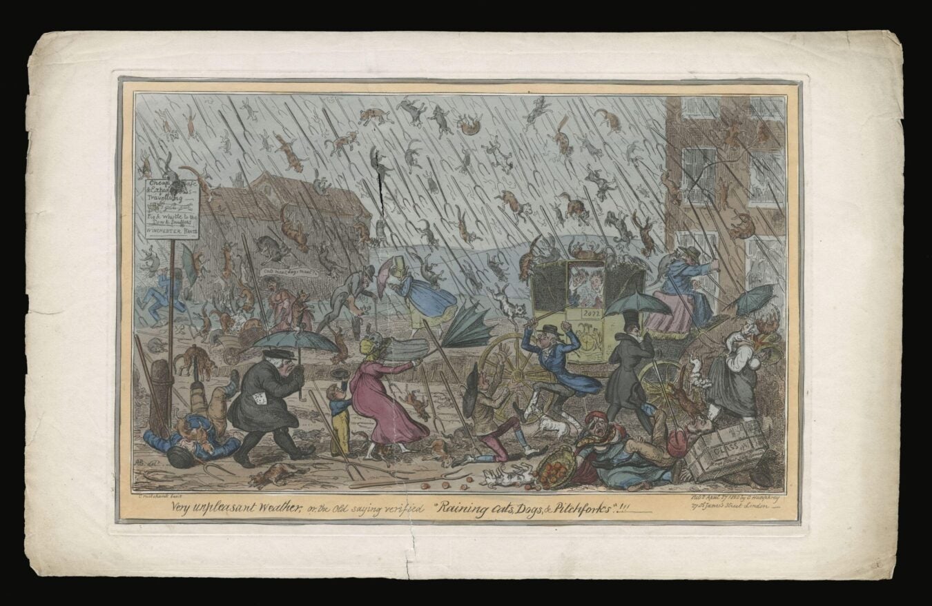 Hand-colored print titled Very Unpleasant Weather, depicting people in a street shielding themselves as cats, dogs, and pitchforks fall from the sky.