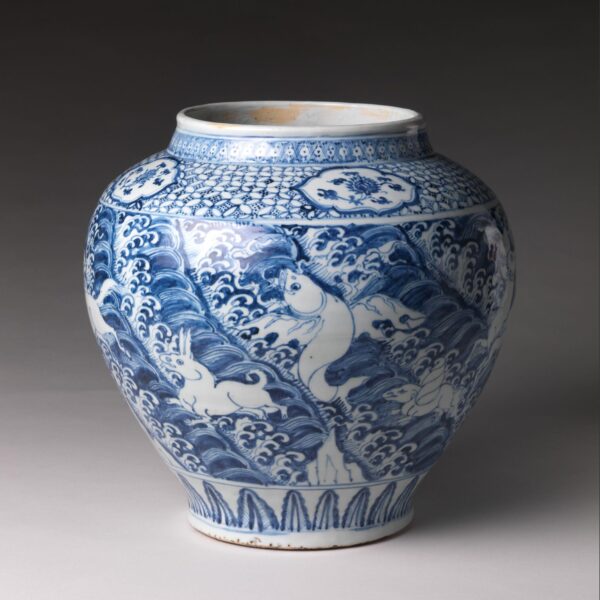Blue and white porcelain jar decorated with mythical winged animals among waves, from 15th-century China.