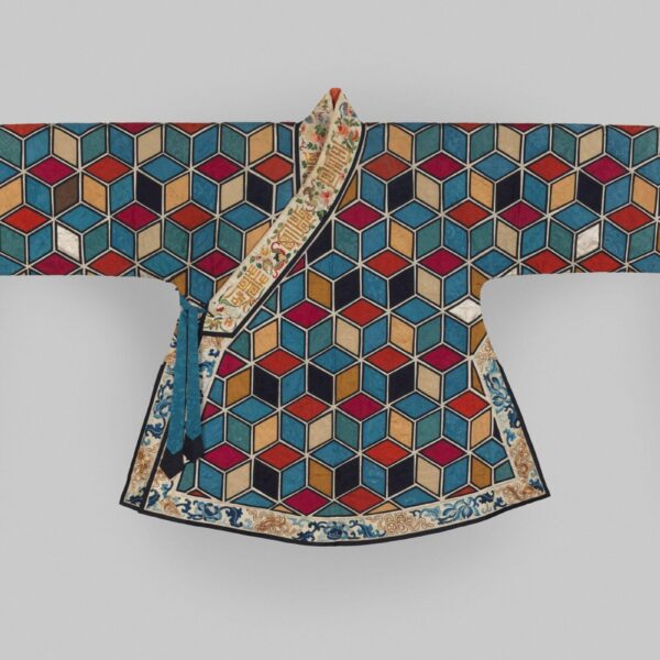 A 19th-century Chinese woman’s theatrical jacket with long white silk sleeves and a body covered in multicolored hexagonal patterns resembling 3D cubes, bordered with embroidered floral designs.