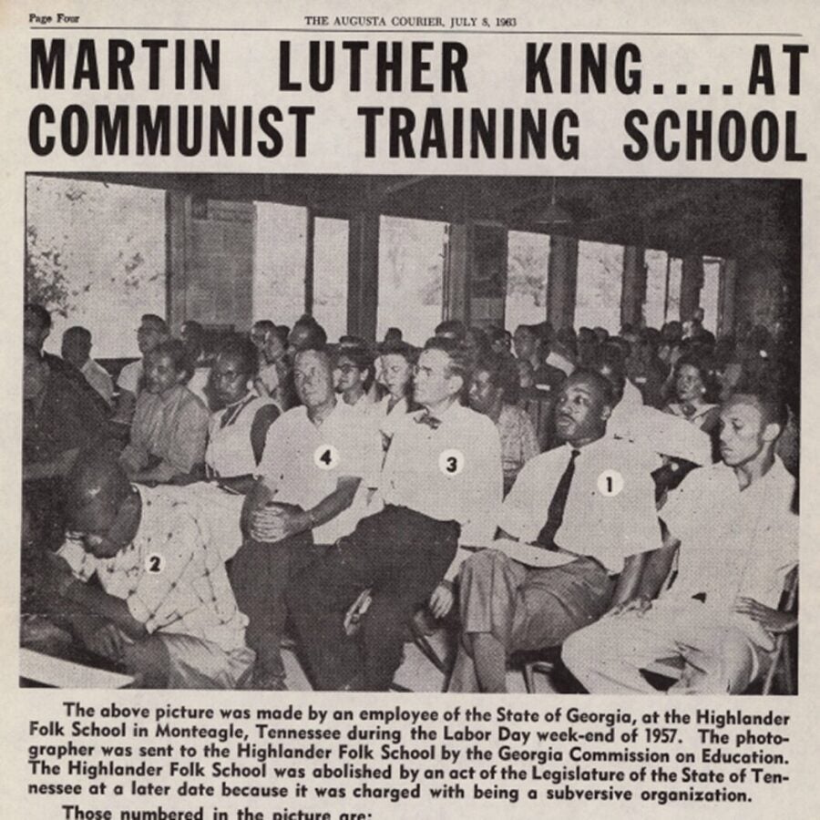 1963 newspaper clipping with photo of Martin Luther King Jr. seated among attendees at the Highlander Folk School, framed by a sensationalized headline.