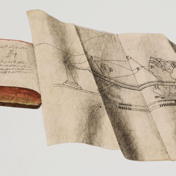 A worn open book sits beside a large, creased sheet of paper showing a detailed line drawing of a classical female figure and geometric measurements.