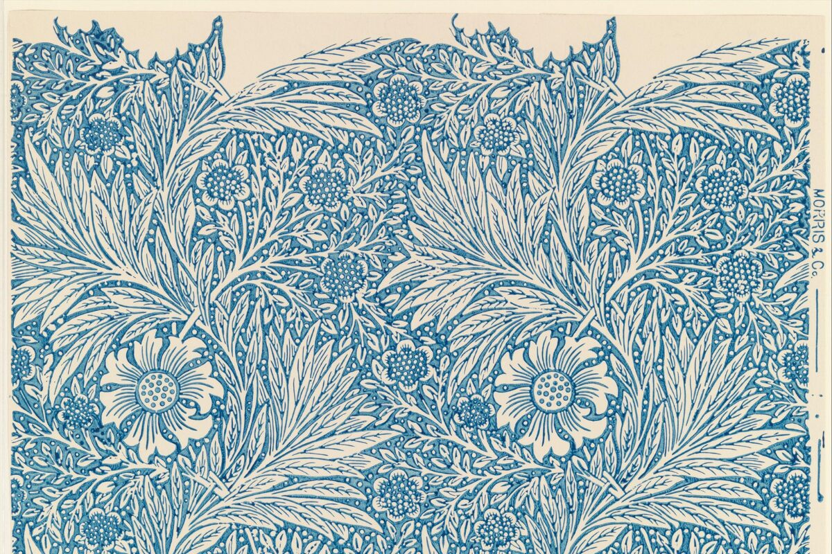 Blue-and-white wallpaper pattern by Morris & Co., featuring dense, stylized foliage and flowers with intricate, interwoven leaves and blossoms.