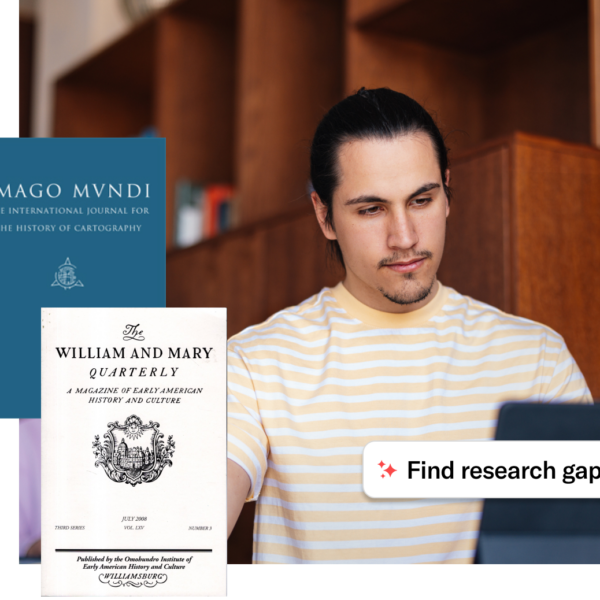 Student writing in a notebook while using a laptop in a library, with journal covers floating around him and a label reading ‘Find research gaps.’