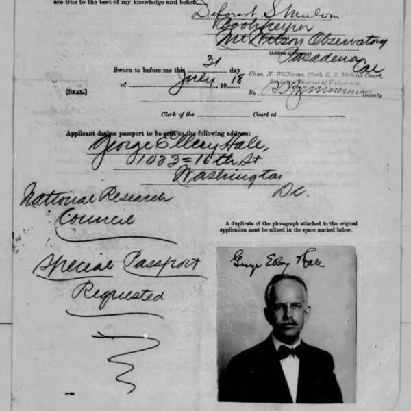 Black-and-white passport application form from 1918 with handwritten details, official stamps, and a small portrait photo of a middle-aged man wearing glasses and a mustache.