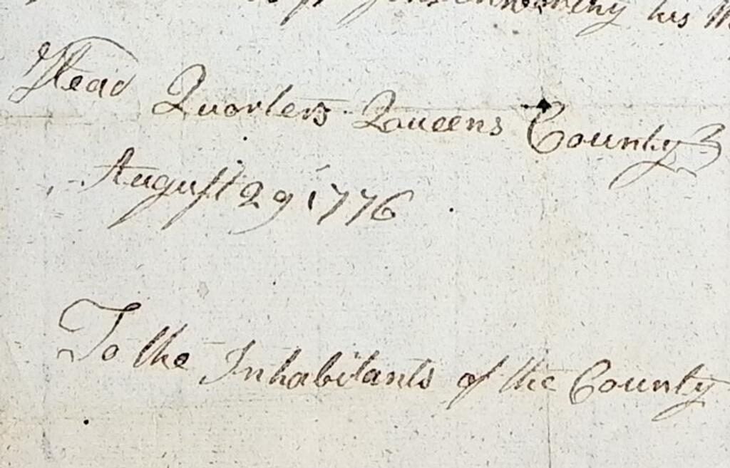 Close-up of a handwritten document dated August 29, 1776, from Queens County. The text reads in part “Head Quarters Queens County August 29, 1776” and begins “To the Inhabitants of the County,” written in cursive ink on aged paper.