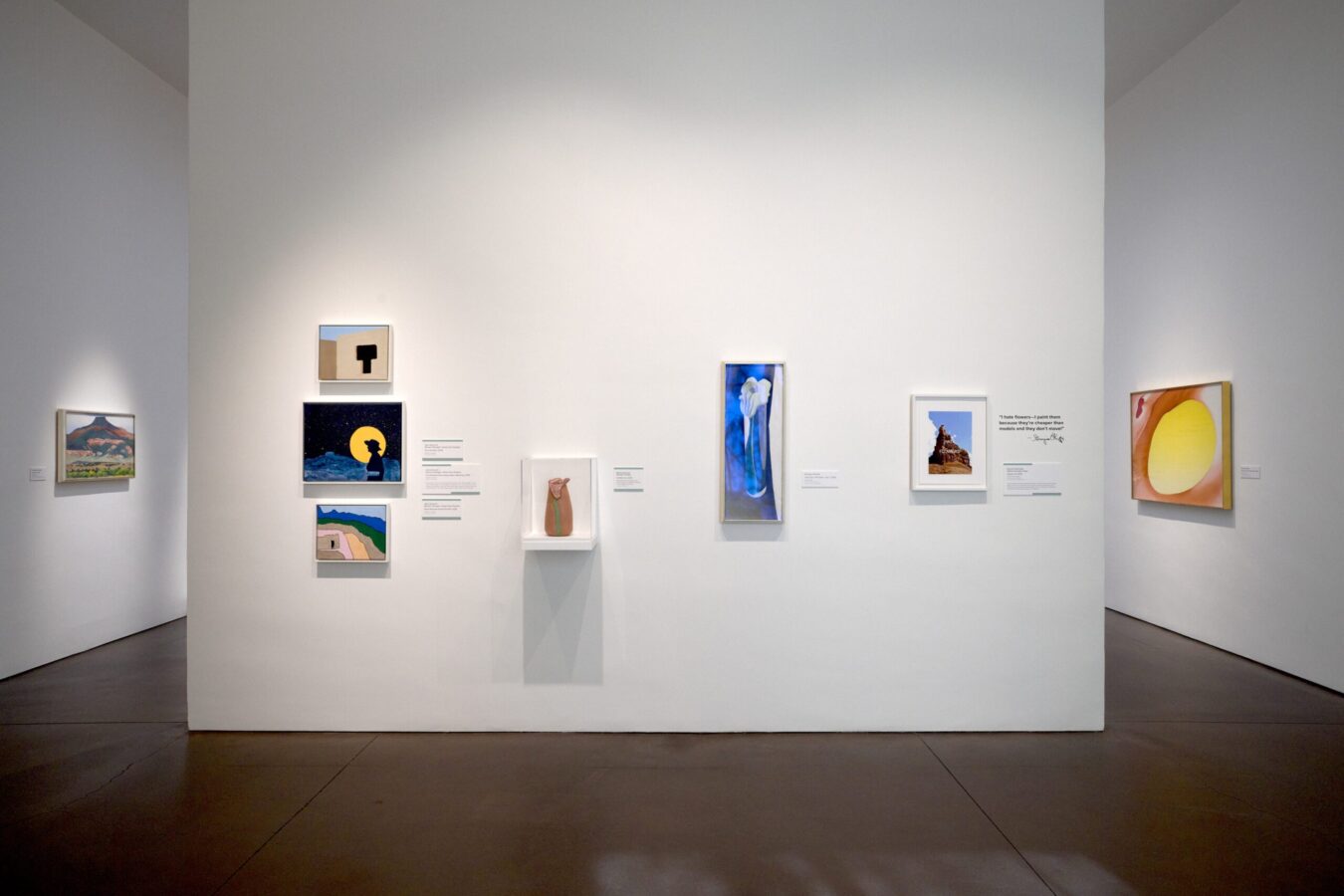 Exhibition installation of Tewa Nangeh at the Georgia O’Keeffe museum featuring wall-based artworks across a central wall, flanked by 2 works on perpendicular walls.